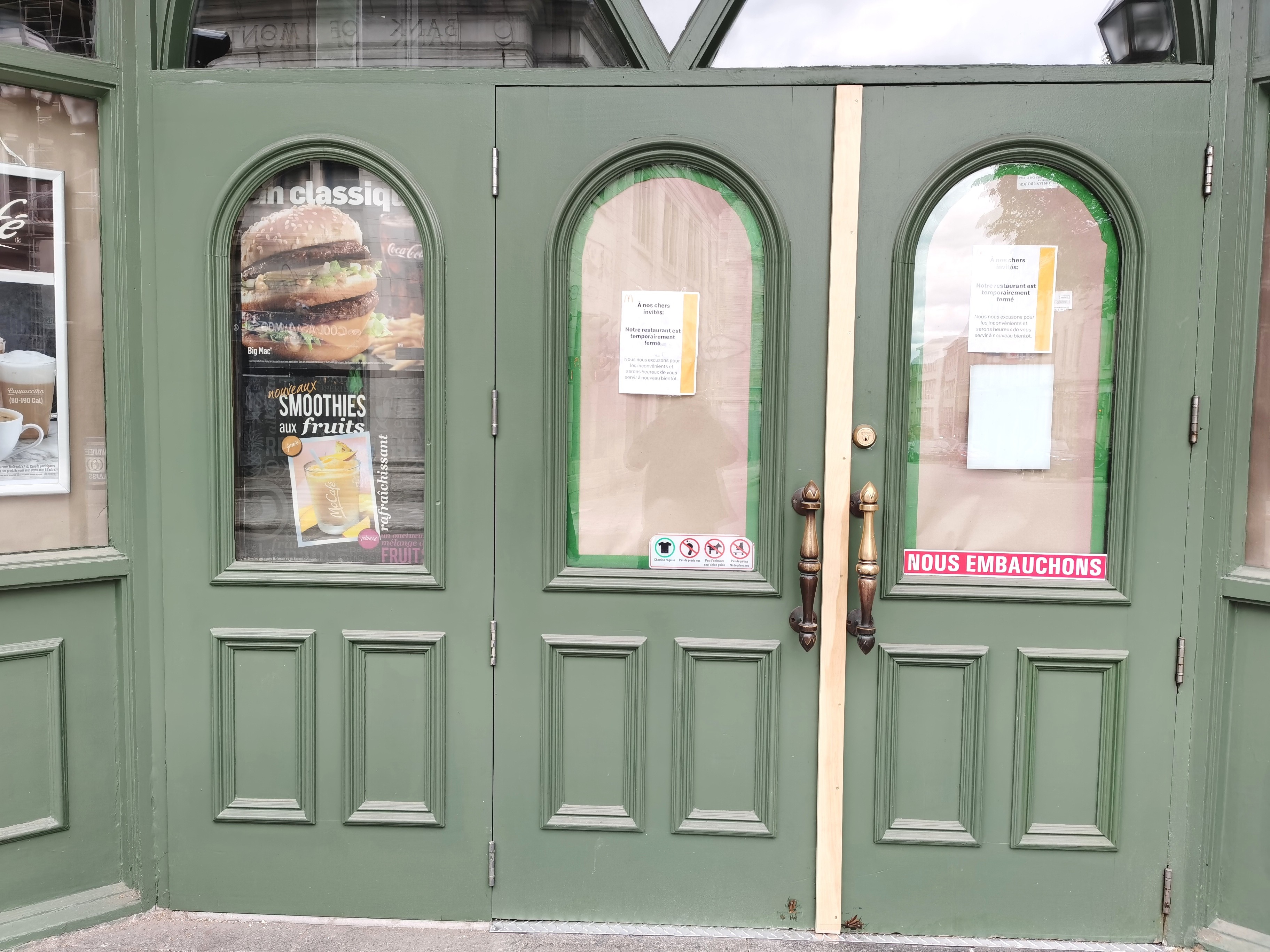 McDonalds in Quebec City, temporarily closed due to COVID19. Windows covered in brown paper.