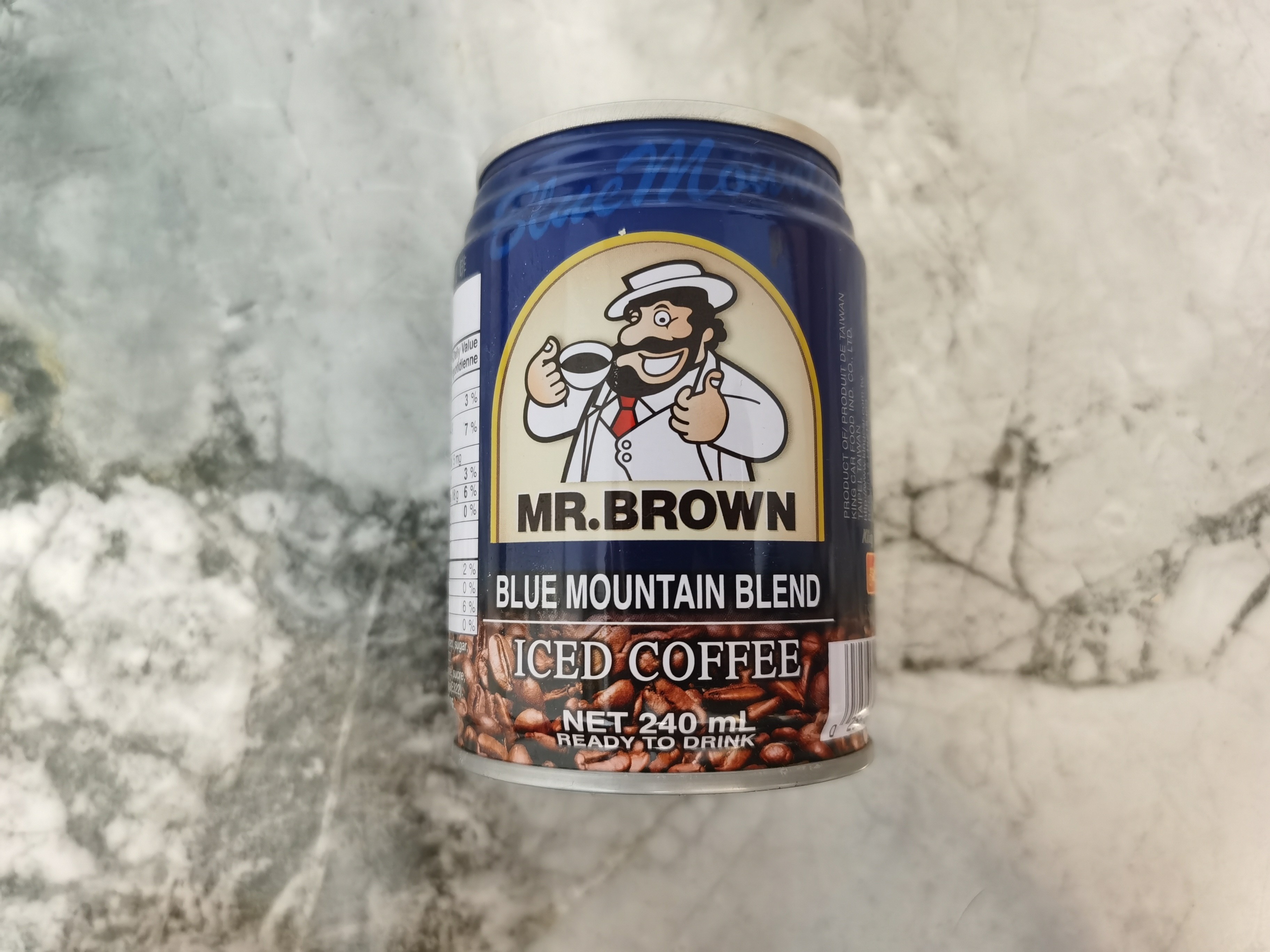 Mr. Brown Blue Mountain Blend Coffee Can on marble background