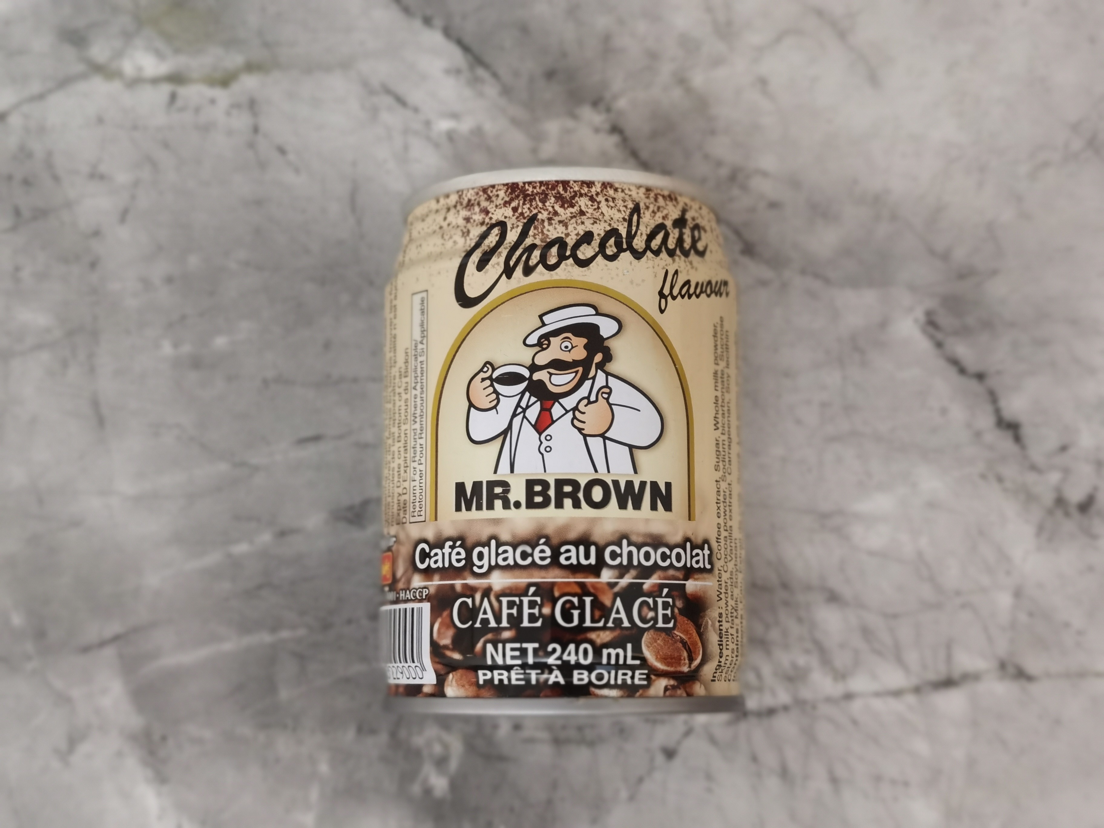 Mr. Brown Chocolate Flavour Iced Coffee Can on marble background
