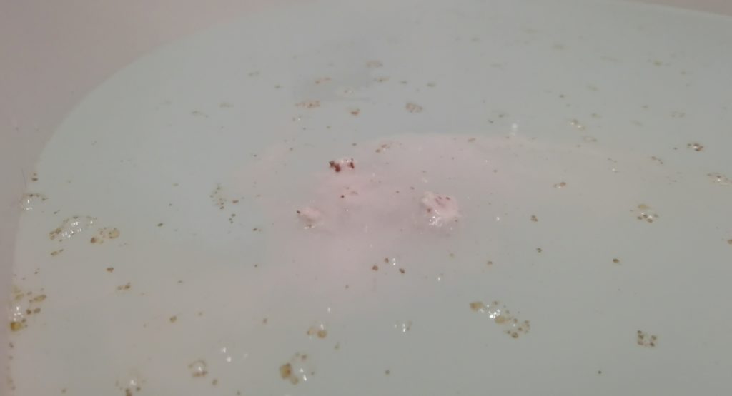 Butterbear Bath Bomb by Lush dissolving in water