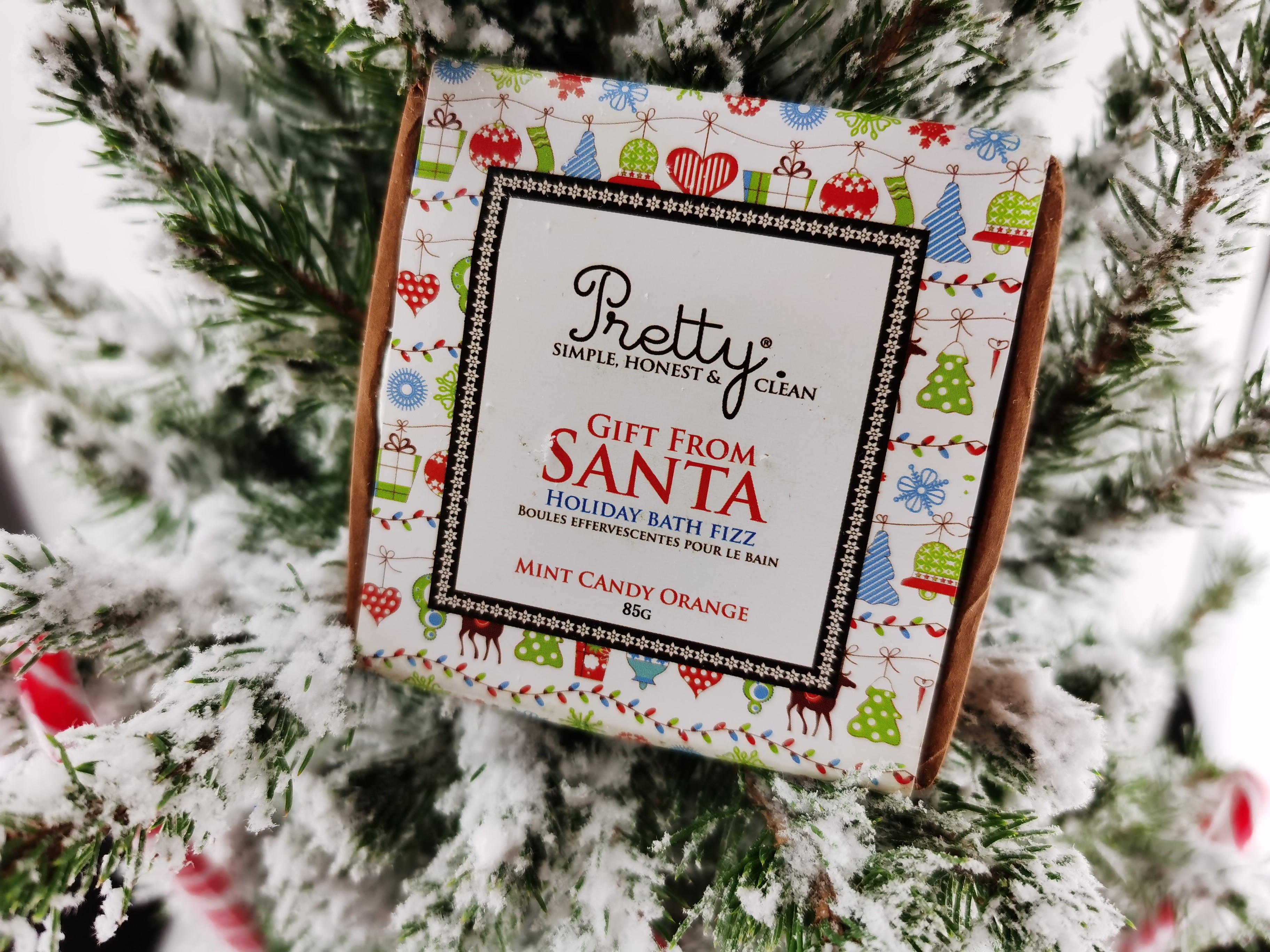 Gift From Santa Holiday Bath Fizz by Pretty Organic Cosmetics in a tree