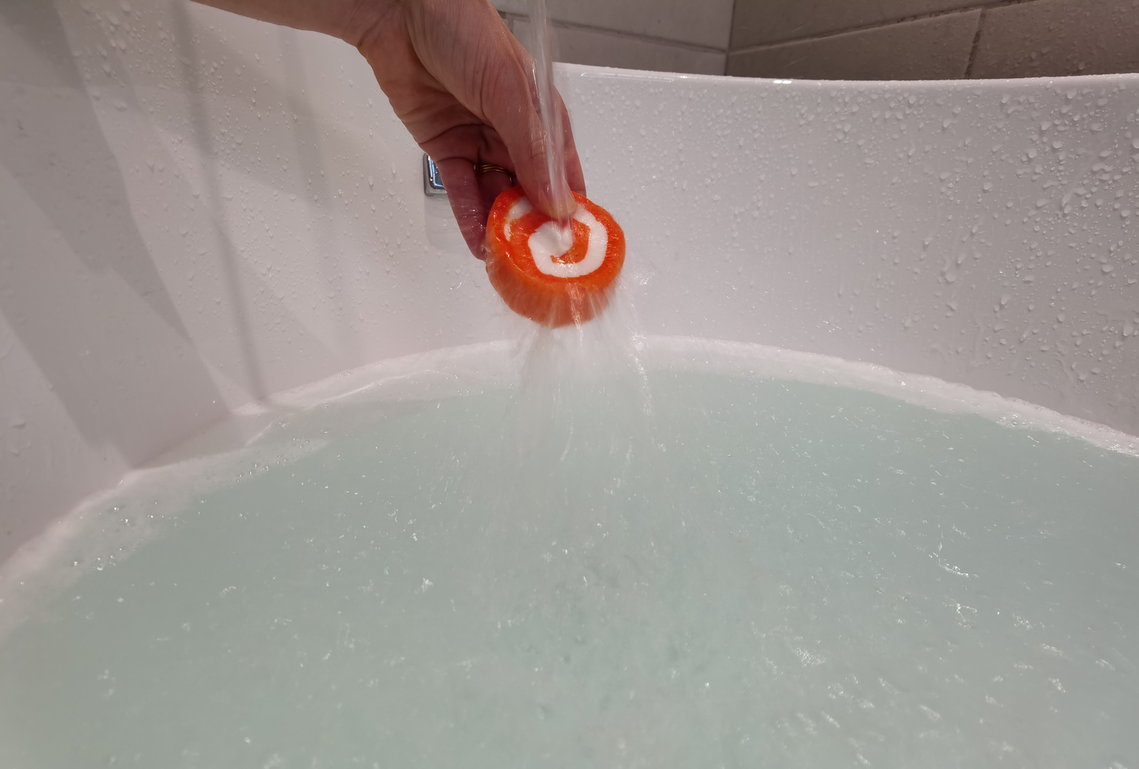 Fresh Peach Bubble Bath Bar by QUO Beauty under water horizontal