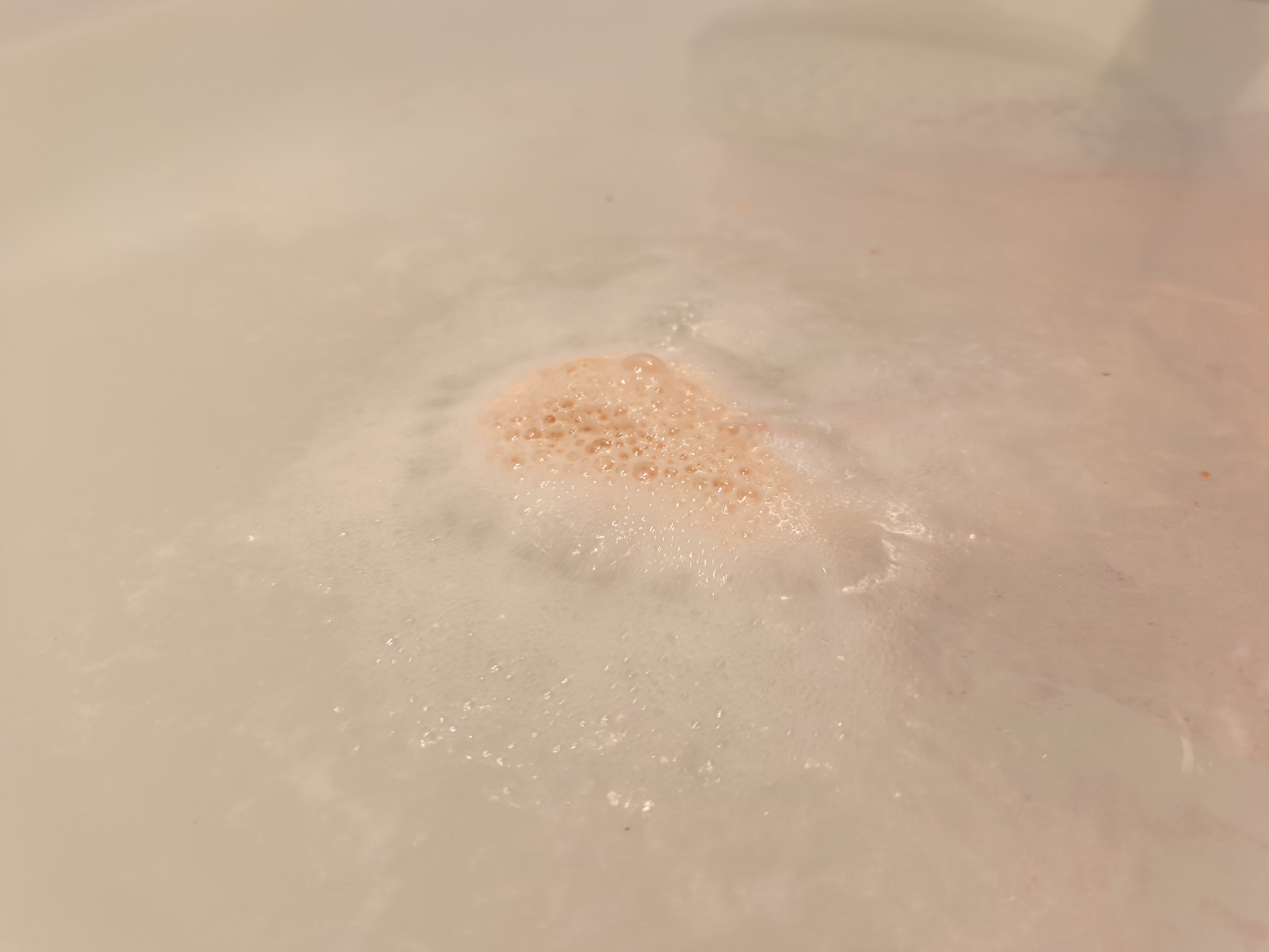 Rose Gold Shimmer Bath Bomb by Pearl Bath Bombs fizzing in bath 2