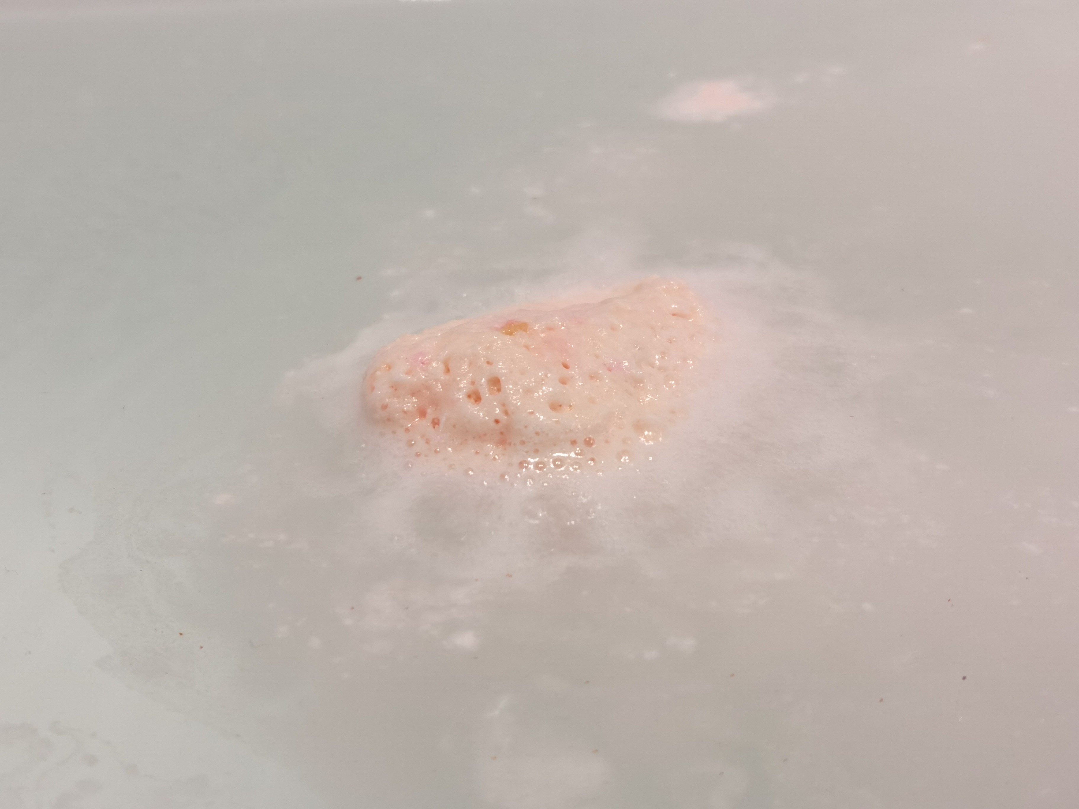 Rose Gold Shimmer Bath Bomb by Pearl Bath Bombs in bath fizzing 3