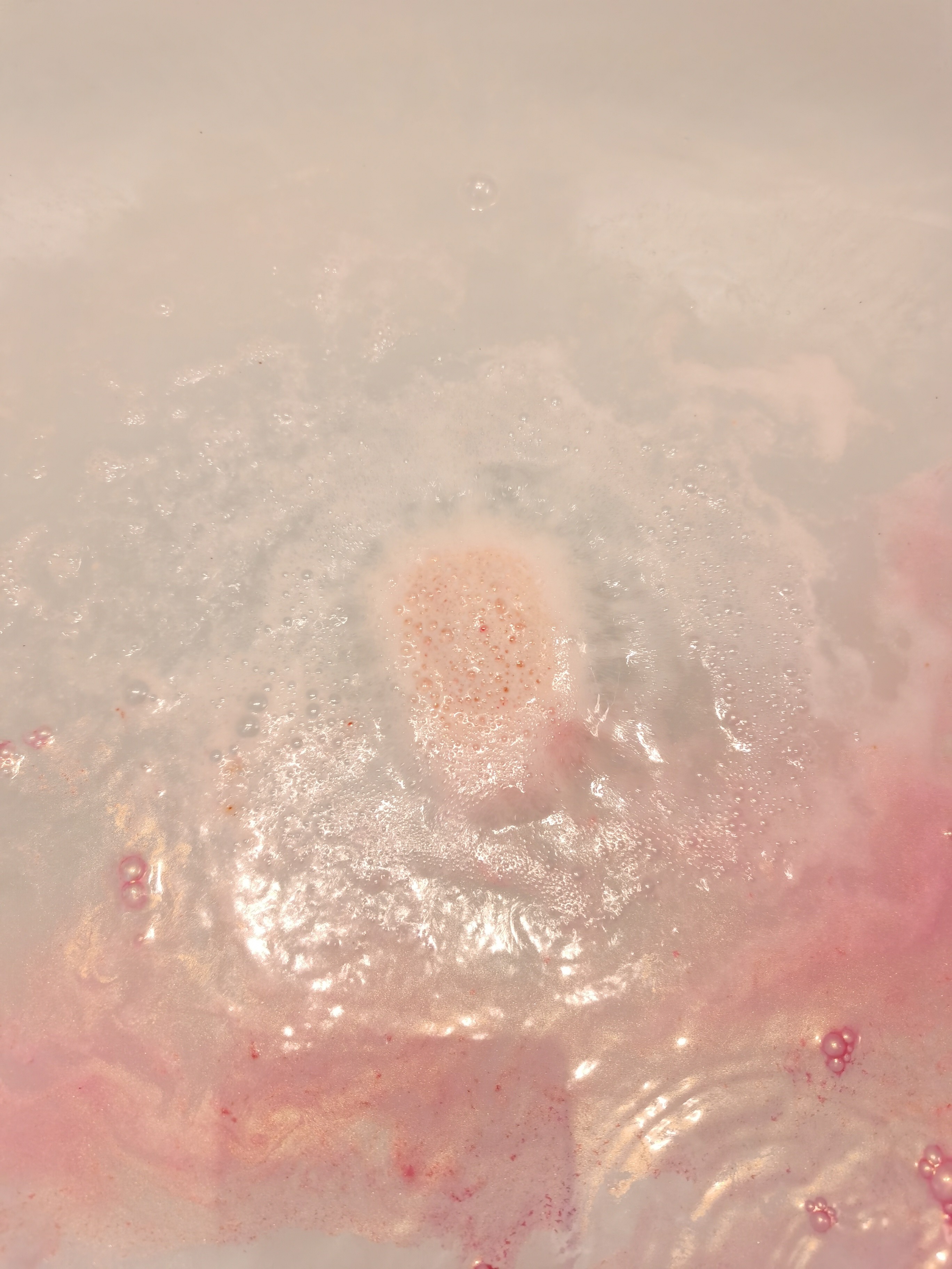 Rose Gold Shimmer Bath Bomb by Pearl Bath Bombs in the bath fizzing