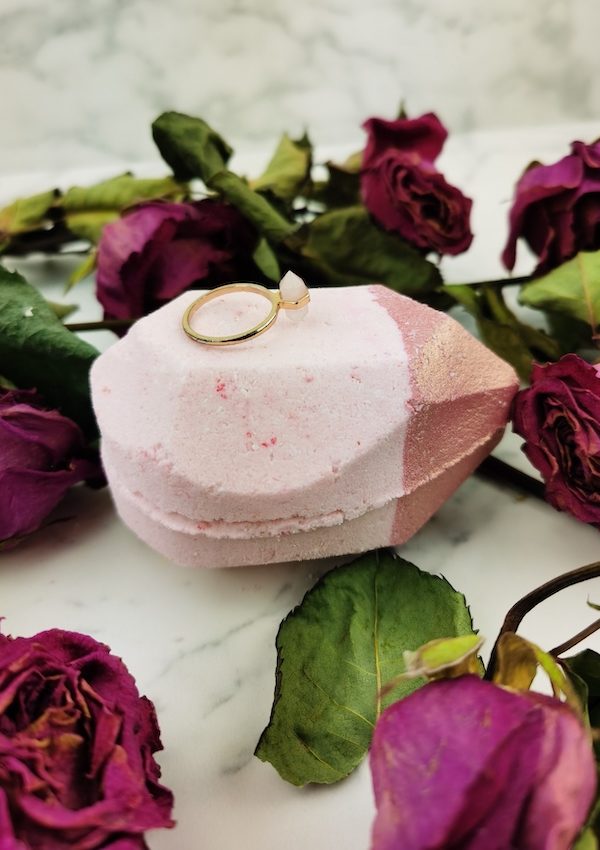 rose gold shimmer bath bomb by pearl bath bombs vertical with flowers