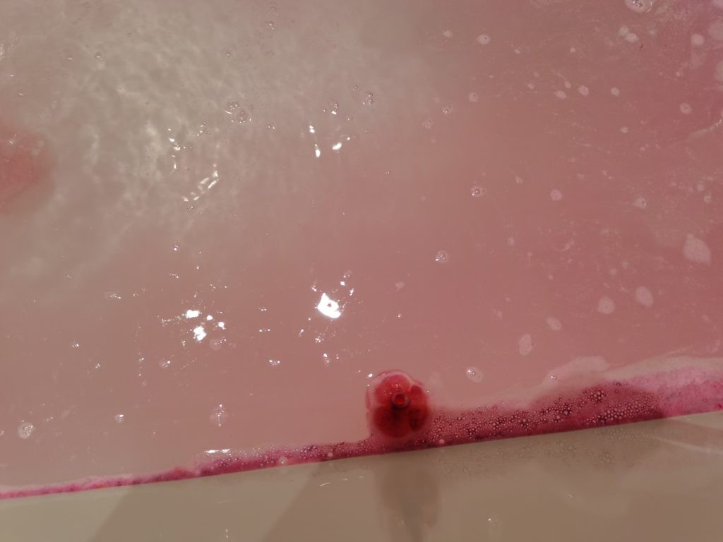 Sex Bomb Bath Bomb rose on pink bathwater