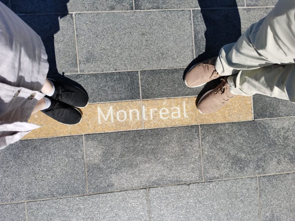 Canada Place Vancouver feet by the Montreal sign
