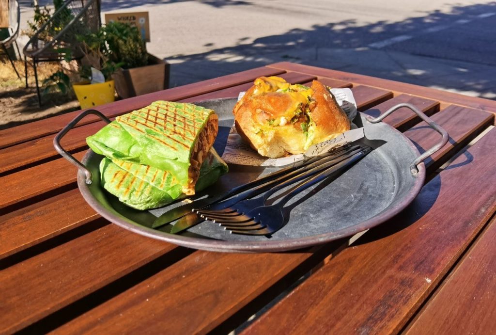 2 pastries from Wicked Cafe on a table outside