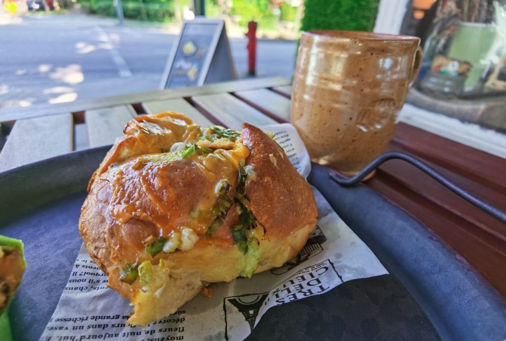 Pastry from Wicked Cafe on a table outside the cafe with a glass of coffee