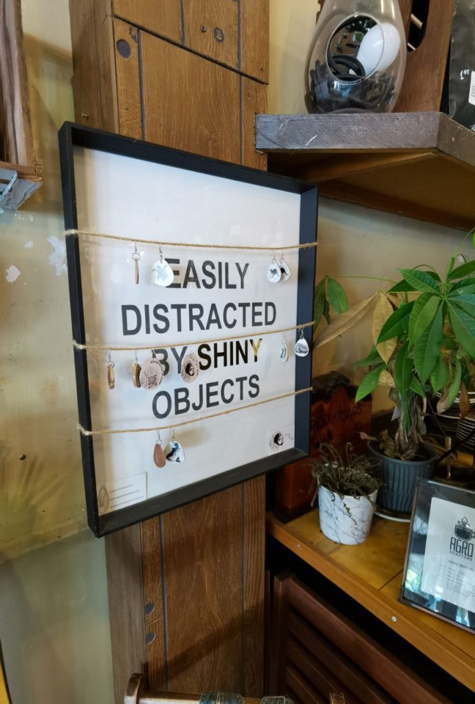 Easily distracted by shiny things sign