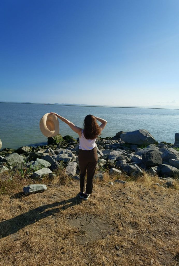 Woman by the water in Steveston Greenways