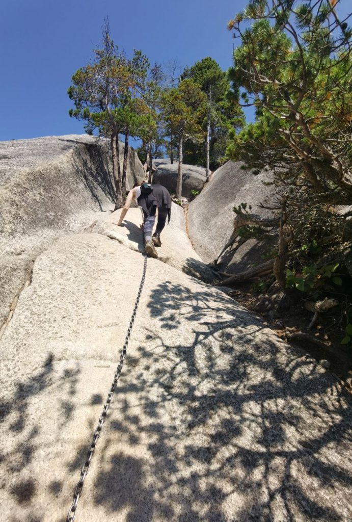 woman climbing Stawamus Chief on the way to the top