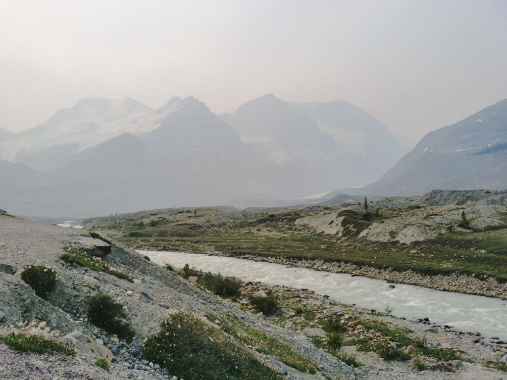 Canadian Rockies by a river with mountains in the background