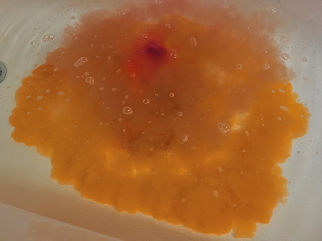 Cloud of orange from the Alien R Us bath bomb