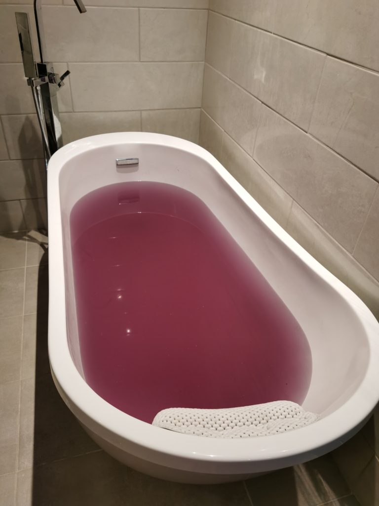 final dark grape bath water color from classic train bath bomb